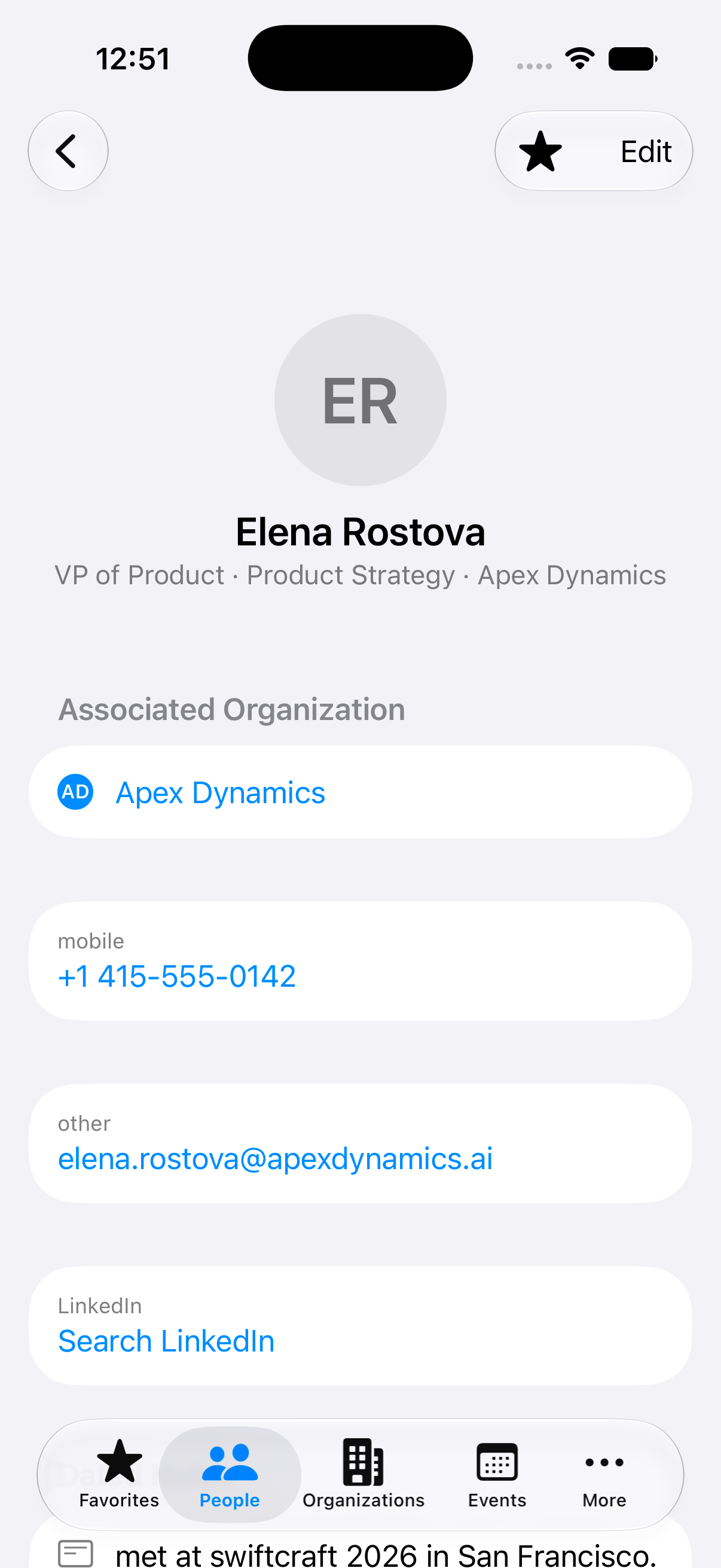 A contact in GuessWho showing the person's organization, phone, email, and a private dated note.